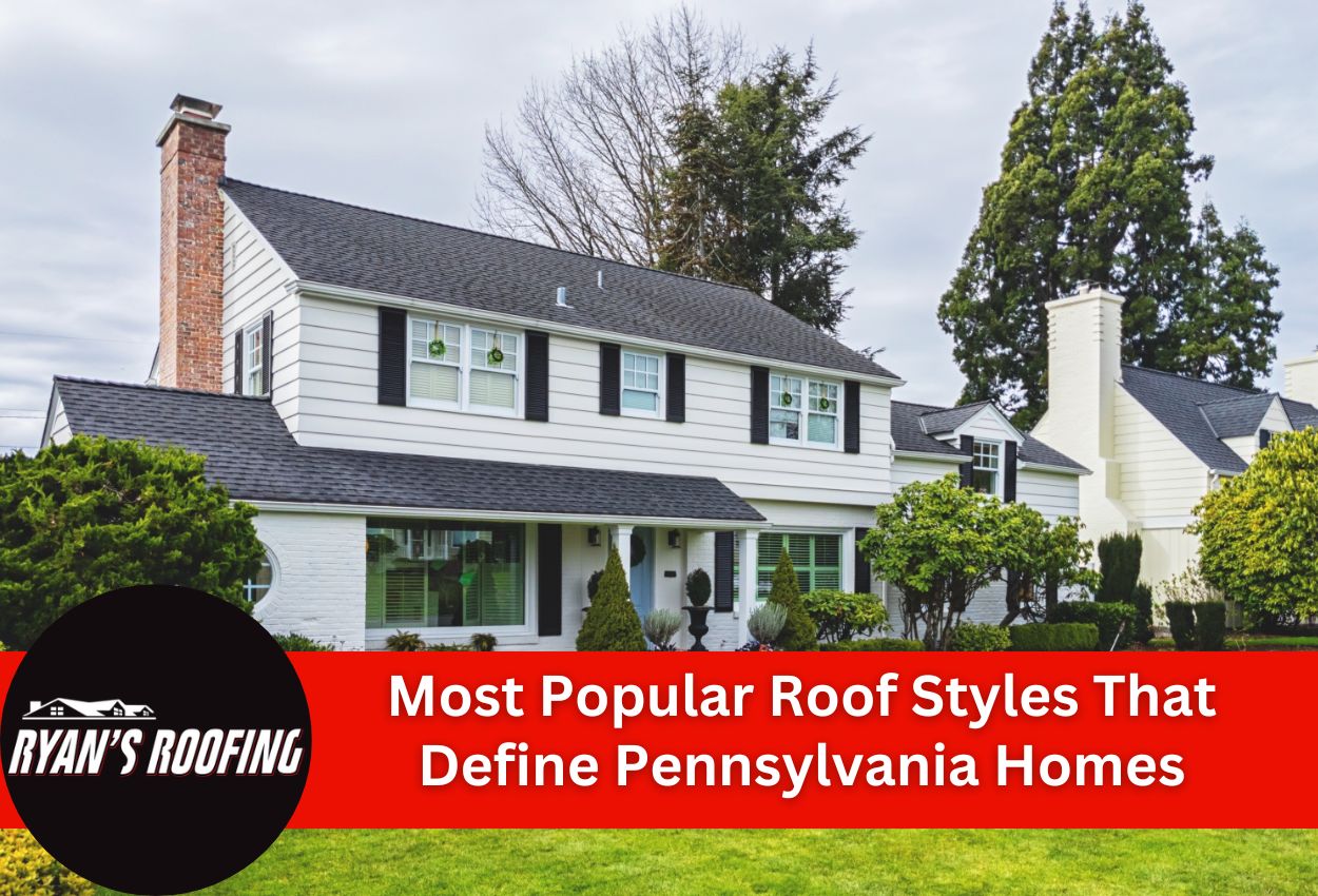 White colonial home with dark shingles showcasing popular Pennsylvania roof styles