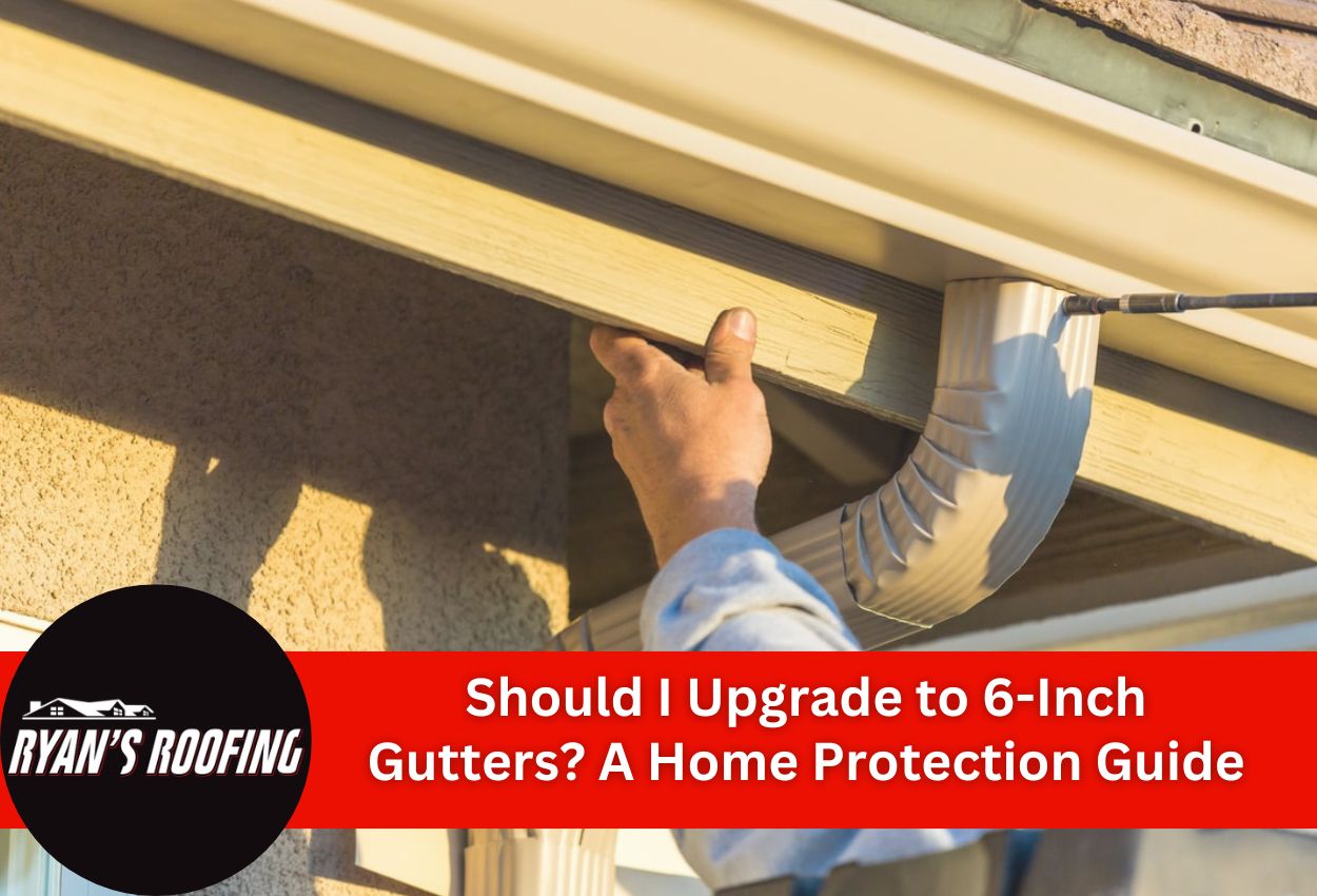 Worker installing 6-inch gutters on residential home for improved water drainage
